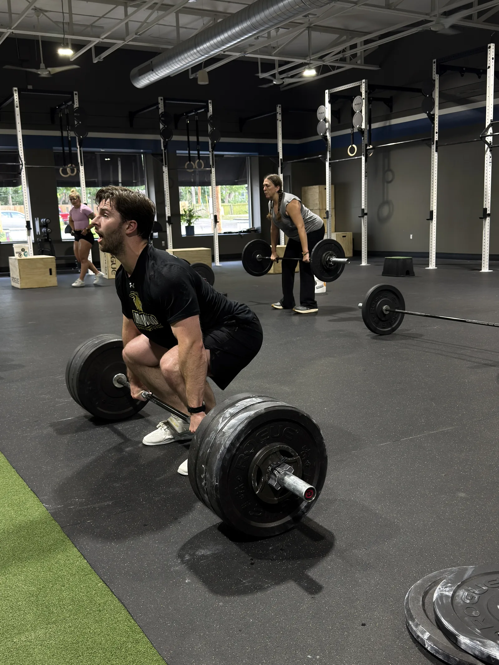 Athlete setting up for a heavy deadlift at Work Ethic KC in Kansas City